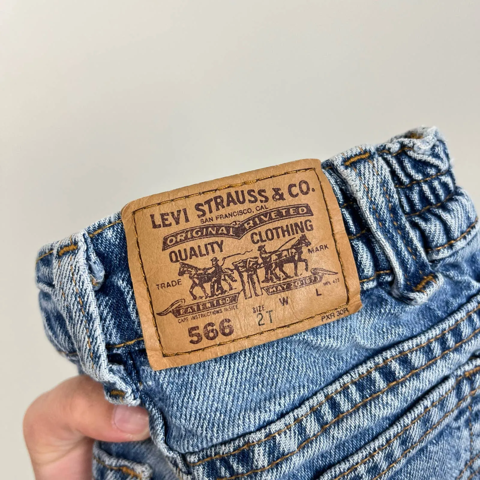 Vintage Levi's 566 Loose Fit Orange Tab Jeans 2T